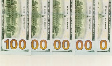 U.S. Banknotes Layed Out Over Each Other To Read as 1 Billion