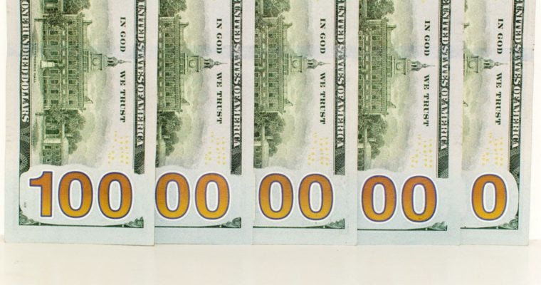 U.S. Banknotes Layed Out Over Each Other To Read as 1 Billion
