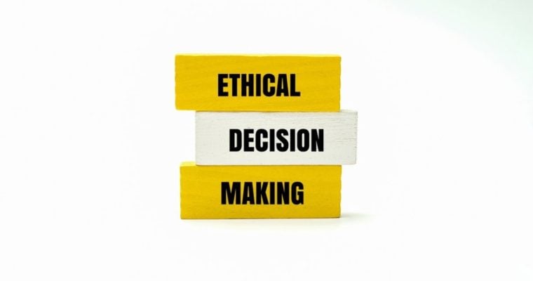 Yellow Wooden Blocks Say Ethical Making and One White Block Says Decision in the Middle
