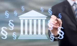 Man in Suit Points to Digital Image of Money Floating Around Washington Capitol Building