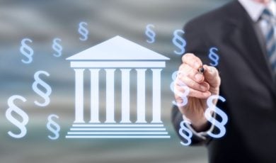 Man in Suit Points to Digital Image of Money Floating Around Washington Capitol Building