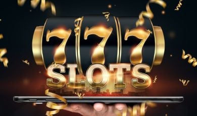 Gold Font Spells Slots and 777 on Black Reel Above Large Tablet Held in Man's Hand