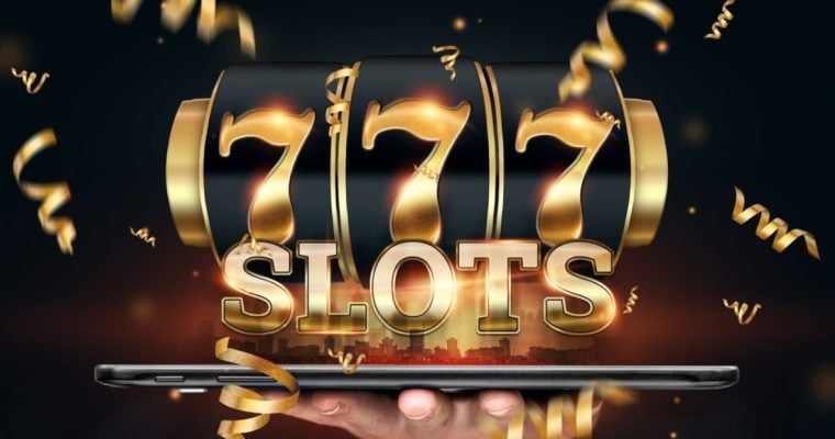 Gold Font Spells Slots and 777 on Black Reel Above Large Tablet Held in Man's Hand