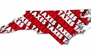 The Word Taxes in Red and White Font Fill An Outline of North Carolina State