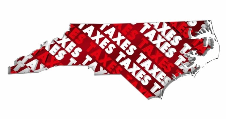 The Word Taxes in Red and White Font Fill An Outline of North Carolina State