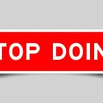 Red and White Rectangular Sign Reads Stop Doing