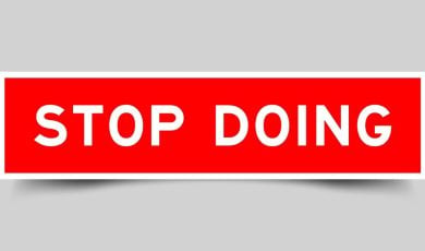 Red and White Rectangular Sign Reads Stop Doing