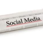 Newspaper Reads Social Media Headline Rolled Up on Isolated White Background