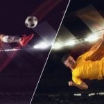 Two Young Male Soccer Players Mid-Air Kicking Ball Inside Stadium