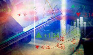 Man Holds Cell Phone in Hand with Digital Overlay of Wave Graphs, Red and Green Market Valuations