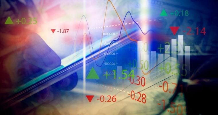 Man Holds Cell Phone in Hand with Digital Overlay of Wave Graphs, Red and Green Market Valuations