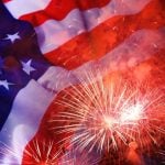 Bursting Fireworks Overlay Image of American Flag in Fourth of July Concept