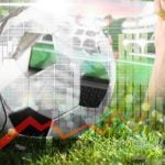 Woman Watches Soccer Match While Holding Ball with Digital Image Overlay of Red Line Graph