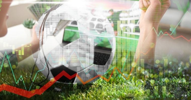 Woman Watches Soccer Match While Holding Ball with Digital Image Overlay of Red Line Graph
