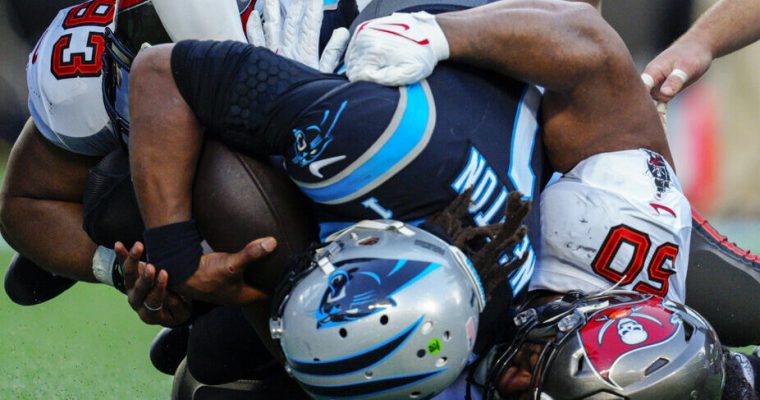 Panthers quarterback Cam Newton sacked