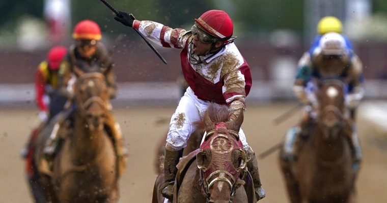 Rick Strike and jockey Sonny Leon are back to compete in the Belmont. (AP Photo/Charlie Neibergall)