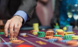 Man placing a bet at the casino