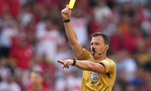 Soccer referee with yellow card