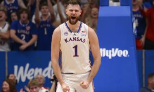 Kansas center Hunter Dickinson celebrates a three-point basket against North Carolina Central during the first half of an NCAA college basketball game in Lawrence, Kan., Monday, Nov. 6, 2023. (AP Photo/Reed Hoffmann)