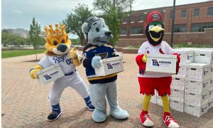 Mascots for the Kansas City Royals, St. Louis Blues and St. Louis Cardinals haul boxes of voter signatures collected in order to put a proposal to legalize Missouri sports betting on the ballot this year Thursday, May 2, 2024, outside the Secretary of State's Office in Jefferson City, Mo.