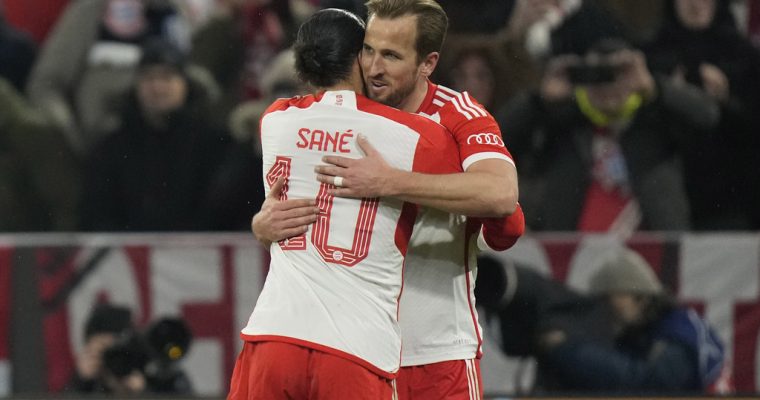 Bayern Munich player Harry Kane celebrates with Leroy Sane in the 2024 Champions League Round of 16 match