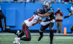 Carolina Panthers running back Chuba Hubbard is tackled in his game against the Tampa Bay Buccaneers in January 2024