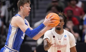 Duke Blue Devils basketball player Kyle Filipowski plays against the Houston Cougars during 2024 March Madness Sweet 16 game