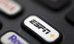 ESPN+ logo and button on remote control
