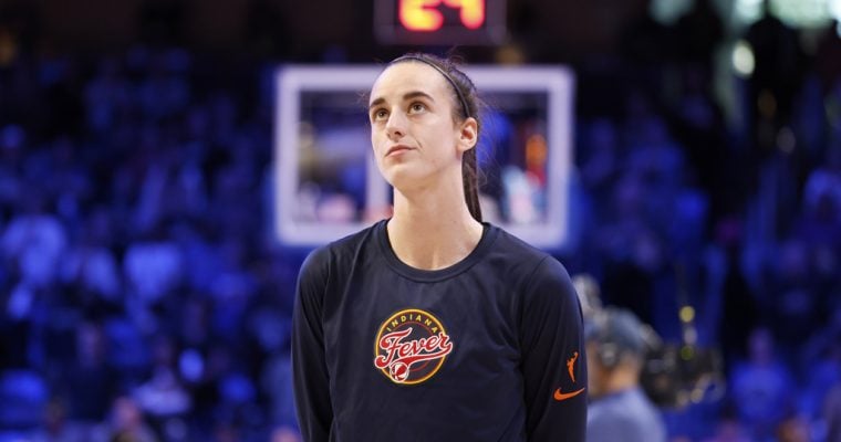 Indiana Fever guard Caitlin Clark on the court before a WNBA preseason game