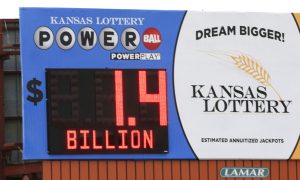 A billboard advertisement for the Kansas Lottery shows the jackpot amount for the Powerball game.