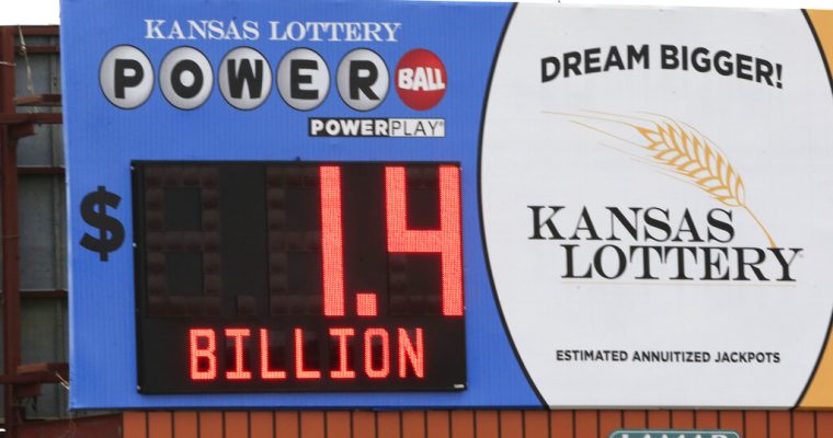 A billboard advertisement for the Kansas Lottery shows the jackpot amount for the Powerball game.