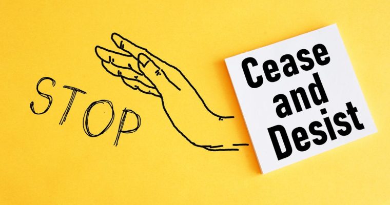an illustration of a hand with stop by it next to a cease and desist sign
