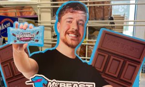 a carboard ad featuring mrbeast and his feastables candy bar