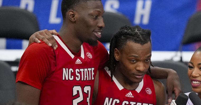 NC State players Mohamed Diarra and DJ Horne after beating Duke in the quarterfinals of the 2024 ACC Tournament