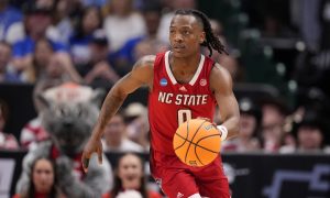 NC State player DJ Horne plays against Duke in a 2024 NCAA Tournament Elite 8 game.