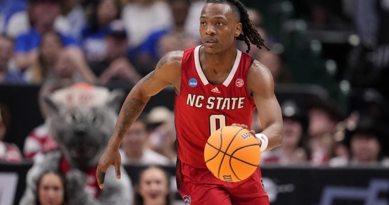 NC State player DJ Horne plays against Duke in a 2024 NCAA Tournament Elite 8 game.