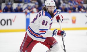 NY Rangers Mika Zibanejad plays against the NY Islanders in a hockey game on April 2024