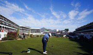 Scottie Scheffler tees off on the 16th hole during the final round of the Phoenix Open golf tournament, Sunday, Feb. 12, 2023