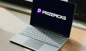 PrizePicks, a daily fantasy sports platform, logo displayed on laptop computer screen