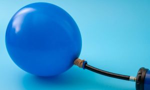 a blue balloon being pumped up