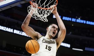 Purdue basketball player Zach Edey dunks the basketball against Gonzaga in the 2024 NCAA March Madness Sweet 16 Contest