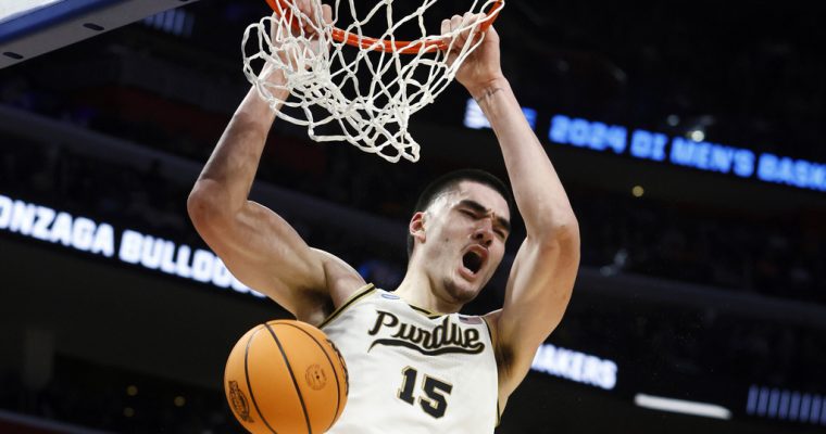 Purdue basketball player Zach Edey dunks the basketball against Gonzaga in the 2024 NCAA March Madness Sweet 16 Contest