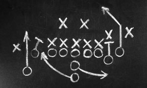 Scheme,Of,Football,Game,On,Chalkboard,Background