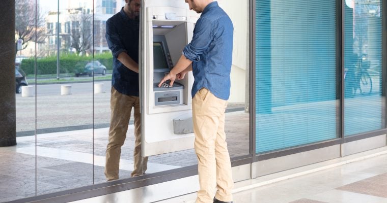 Man making cash withdrawal at ATM